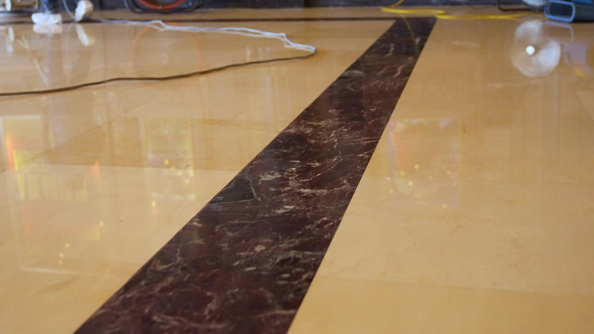 Polished marble floor with warm reflections at the Pantages Theatre
