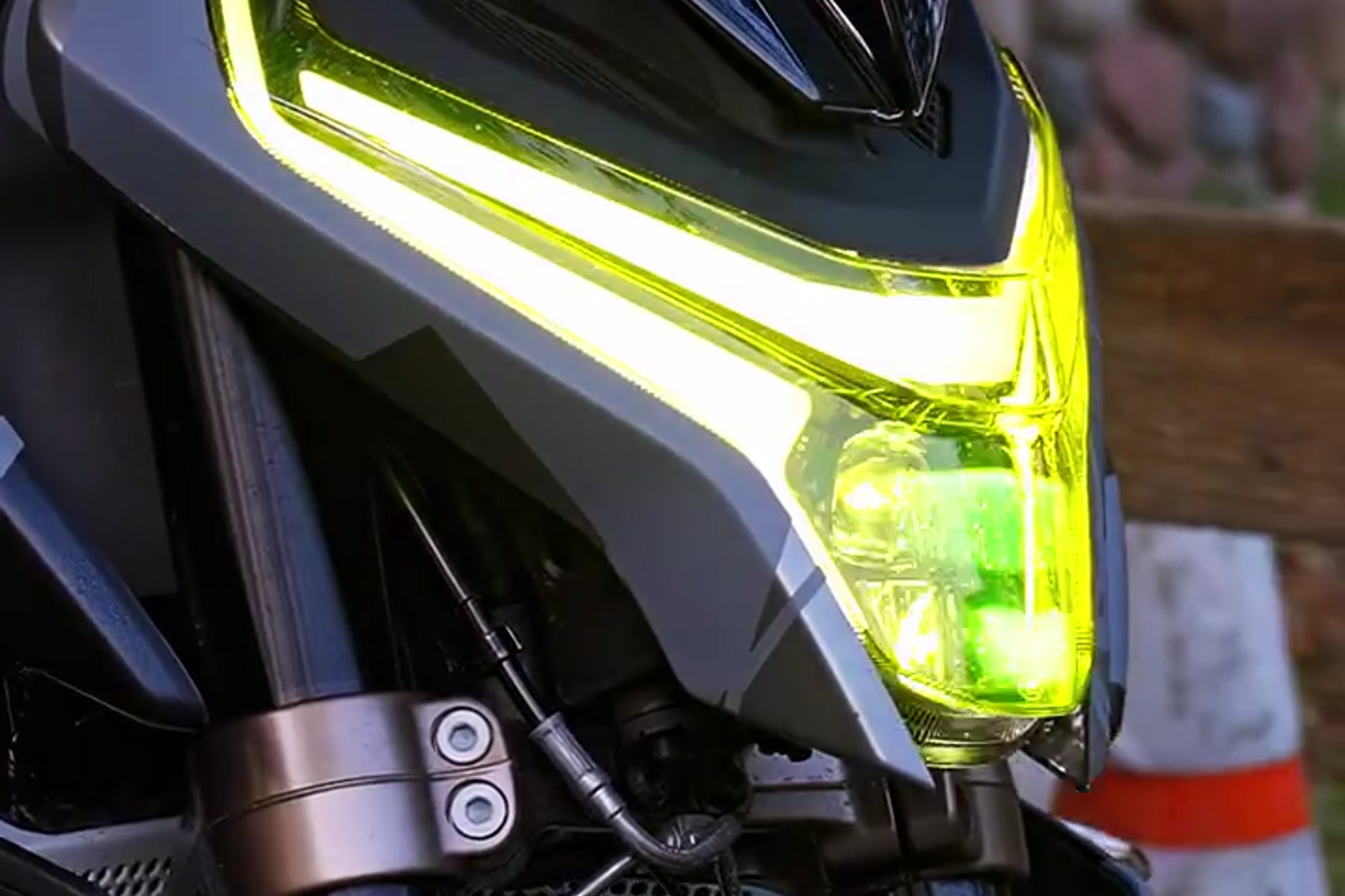 Close-up of a CF Moto motorcycle headlight